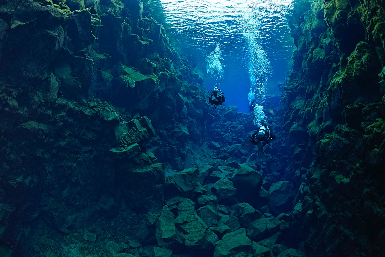 Divers heading into Silfra hall from Cathedral