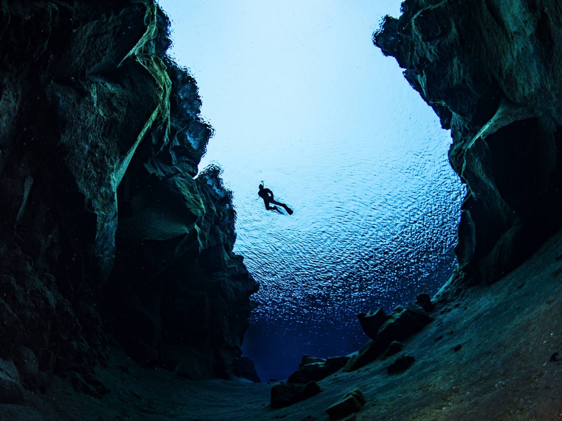 the-view-from-below-snorkeler-between-tectonic-plates-silfra.jpg