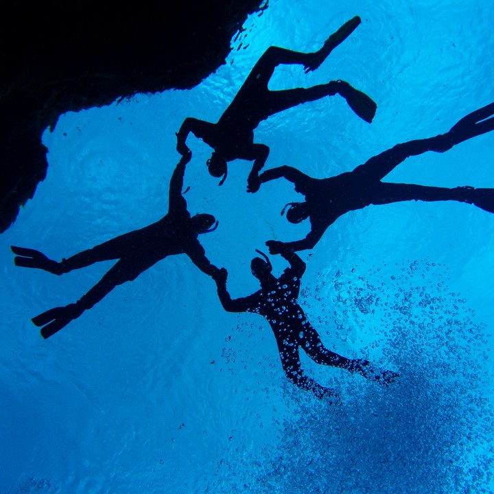 snorkelers-posing-photographer-silfra-iceland-dive-is-720x720.jpg