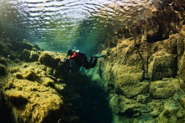 Scuba diving in Bjarnagjá fissure in Reykjanes, Iceland