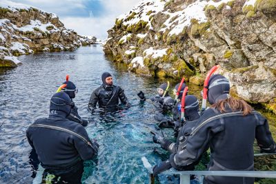 family-snorkeling-silfra-tour-diveis-iceland-400x267-q80.jpg