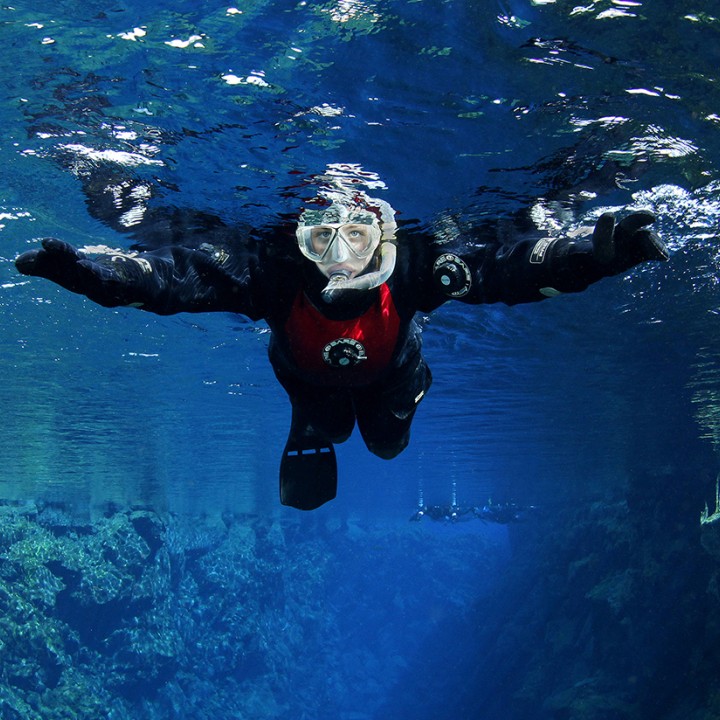 snorkeler-surface-floating-silfra-iceland-tobias-friedrich-720x720.jpg